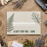 Rustic gardening flat lay featuring a $100 Nature Hills Nursery gift card centered on a burlap cloth.